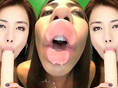 Asian Girl Lick Camera and Suck Dildo